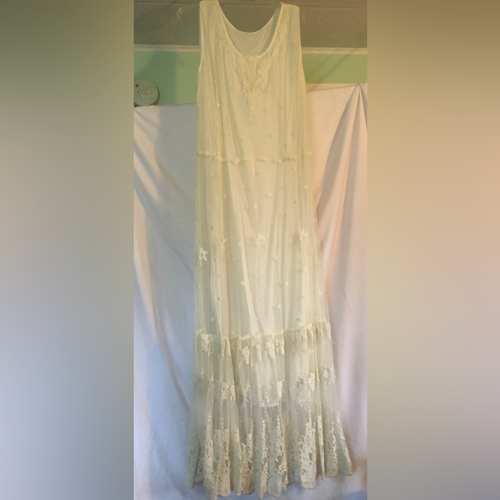 Beautiful ivory dress with a lace overlay.